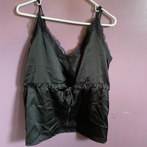 Satin feel camisole top with lace trim.